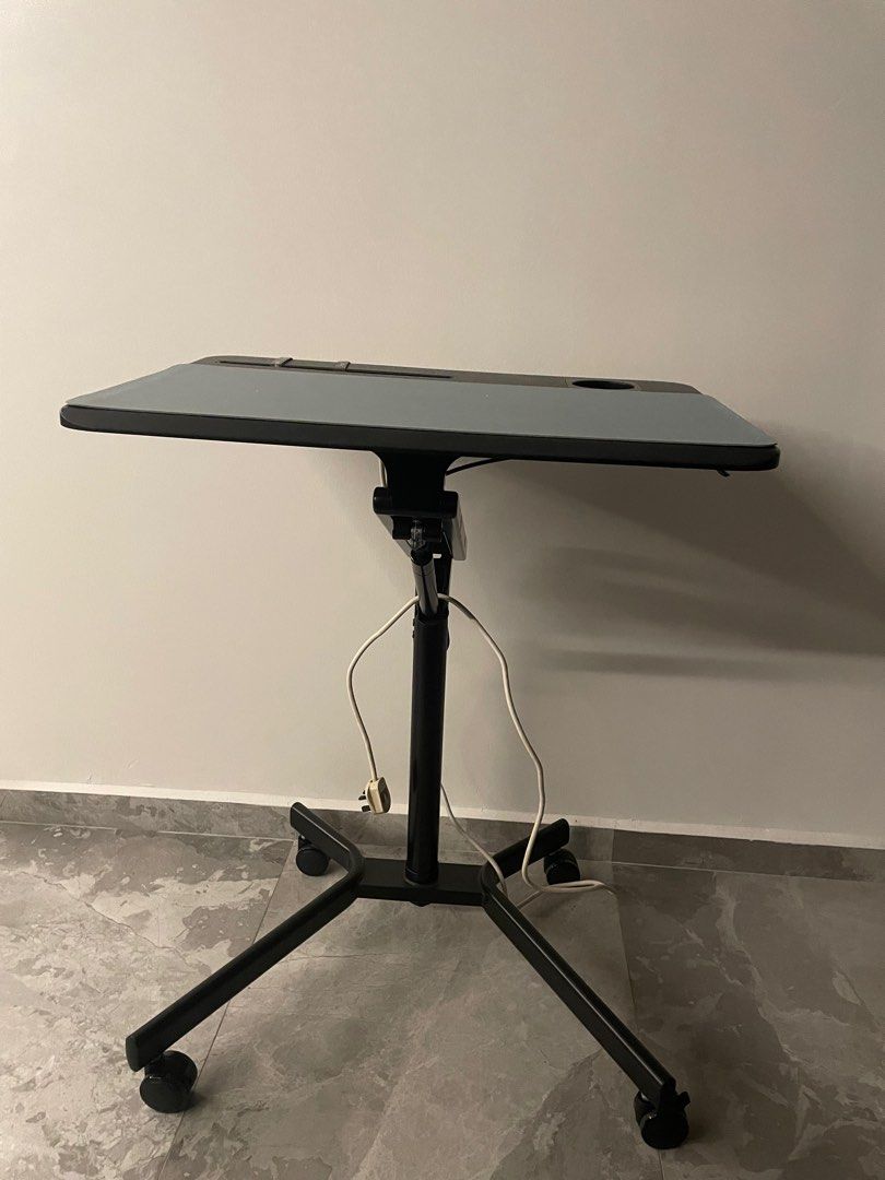 Height adjustable table (Category: Tables & Sets) located in Singapore. Submitted by magadoogoo (Listing ID 1212964967, Image 1). Description: Lightly used height adjustable table. Discount if bought with portable monitor / desktop arm and laptop mount.