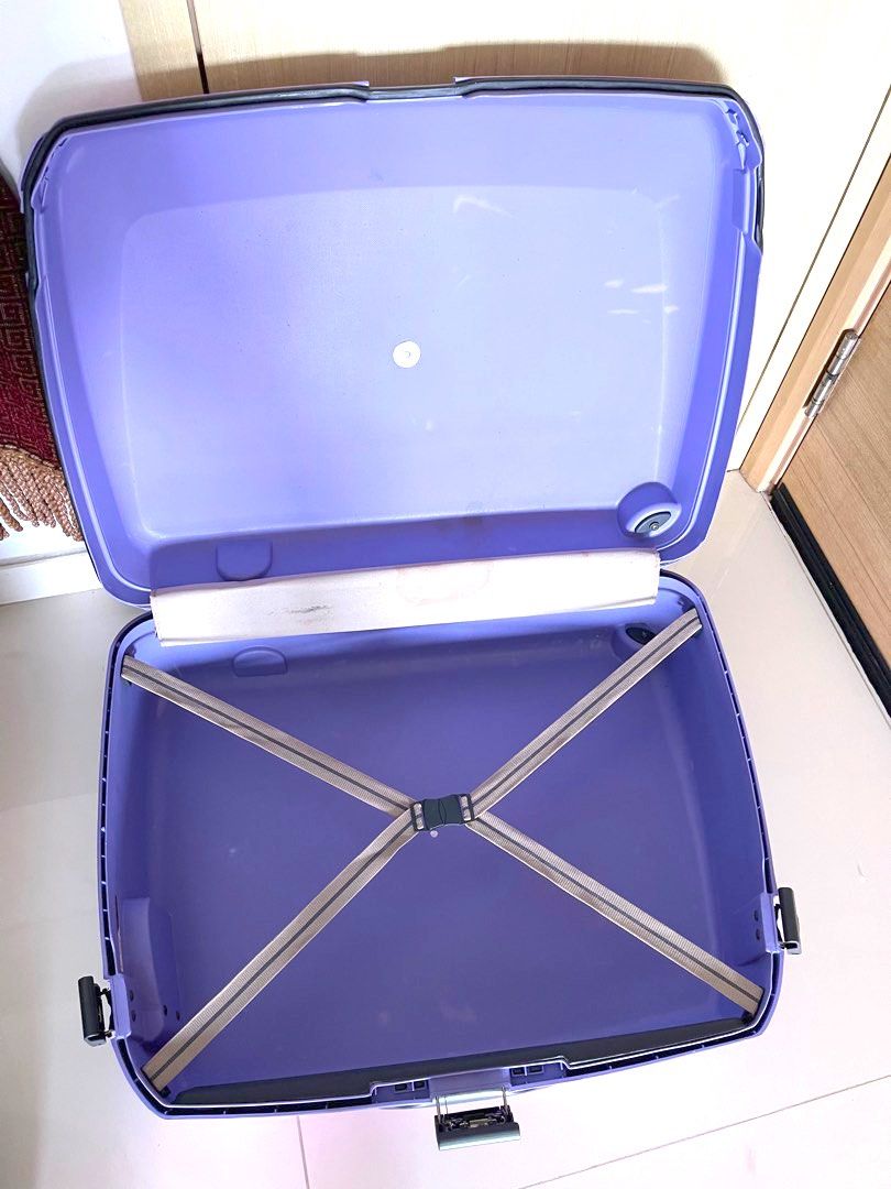 Purple Carlton Airtec hard case luggage. Height 50cm measured from above wheels not including wheels width 65 cm depth 22 cm