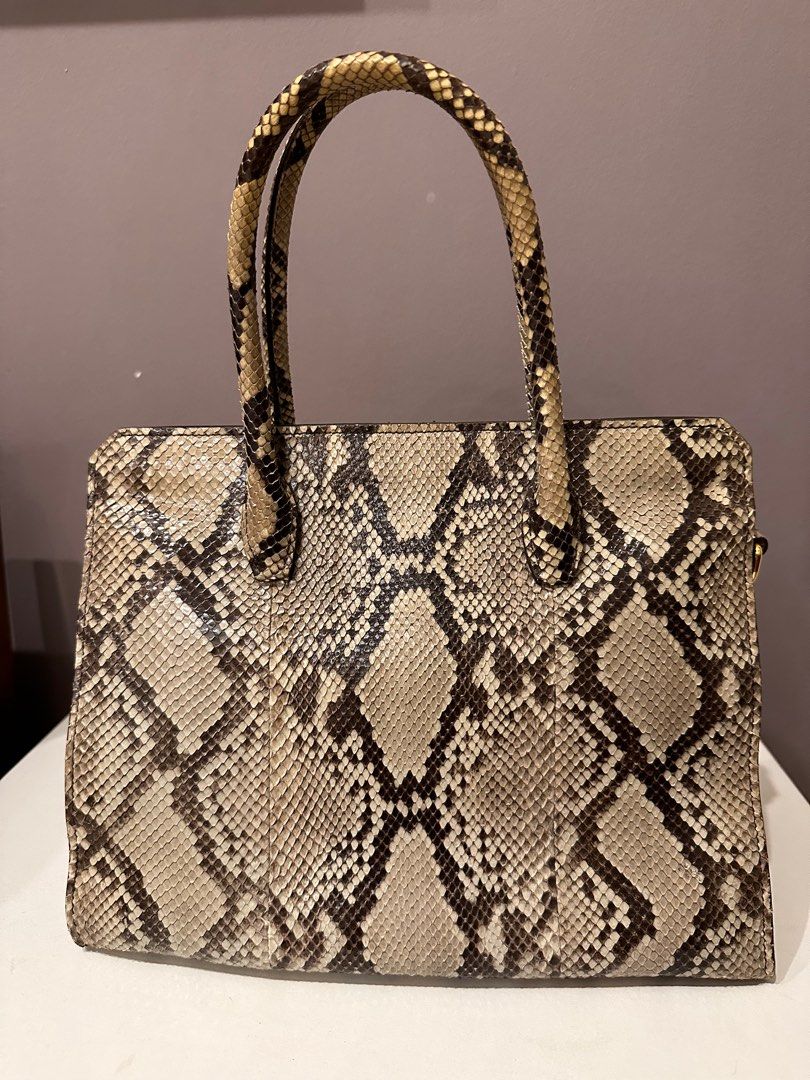 Miu Miu python handbag (Category: Bags & Wallets) located in Singapore. Submitted by vt253 (Listing ID 1216414865, Image 2). Description: Comes with shoulder strap (also in python) Comes with dust bag but no receipt. Guaranteed authentic. .