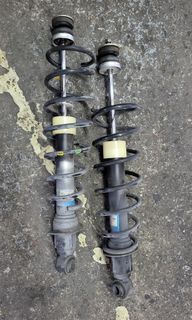 MX5 NC1 rear shocks with springs and accessories.