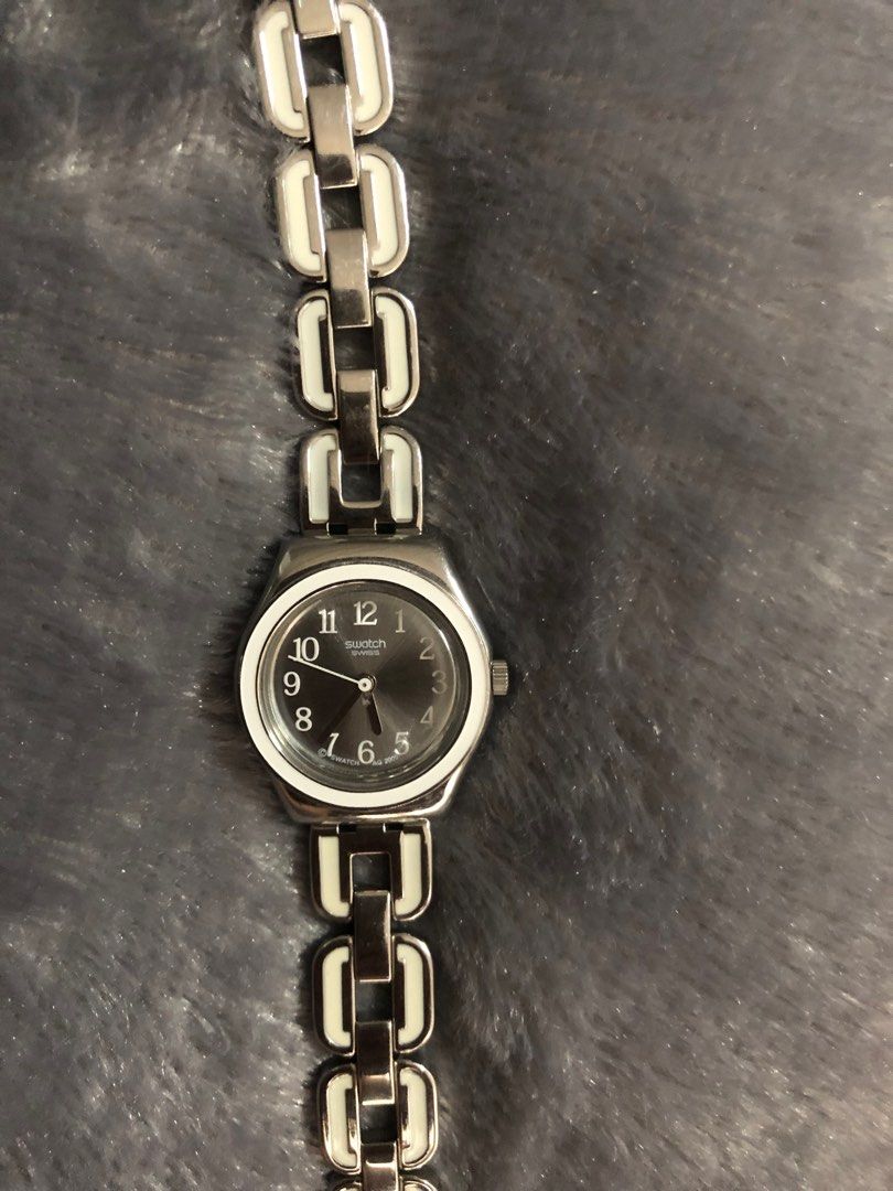 Swatch Irony Lady WHITE CHaIN Watch (Category: Women's Watches) located in Quezon City. Submitted by dmx01 (Listing ID 1216364240, Image 3). Description: Swatch Irony Lady WHITE CHaIN - White Stainless Steel Strap Watch Movement Type: Quartz Dial Size: 25mm Water Resistance: 30m Dial Glass: Hesalite Crystal Model: YSS254G In Good Condition Where is as is.