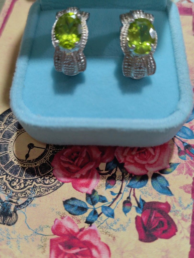 Peridot earrings (Category: Earrings) located in Marikina City. Submitted by dlsctrading (Listing ID 1216527486, Image 2). Description: For sale.. Peridot earrings set in silver with markings, clip type. Very comfy to wear.. Free shipping.. With freebies.