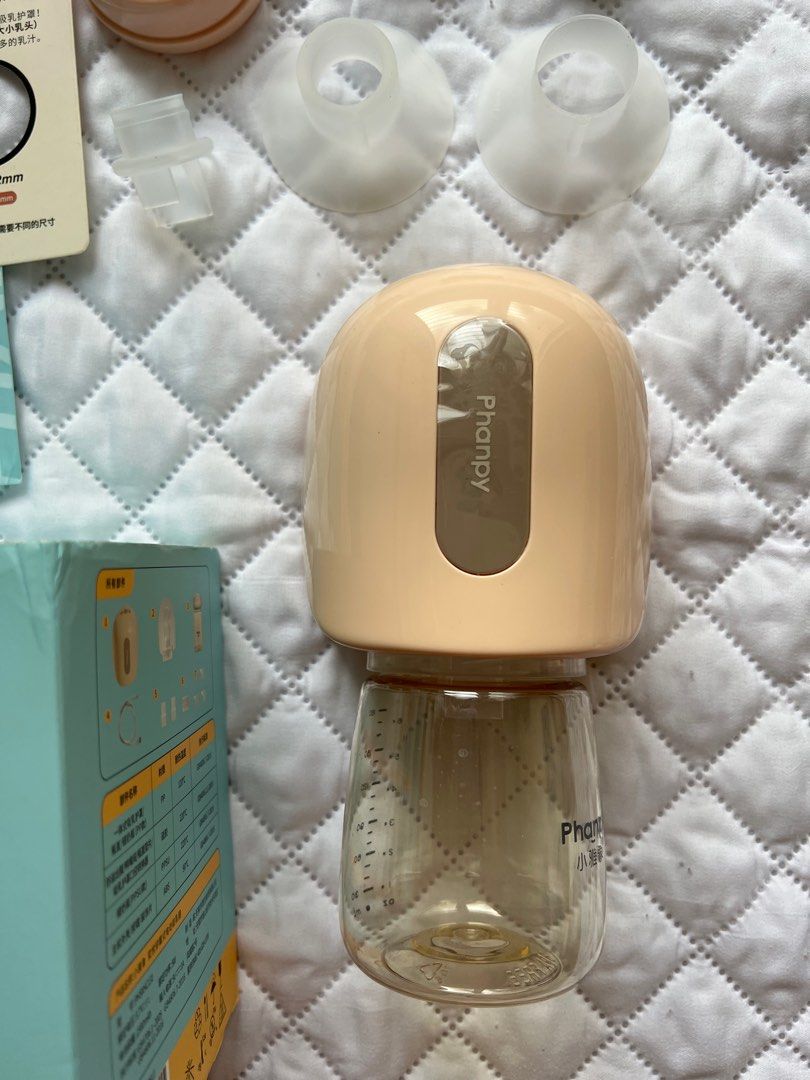 Phanpy wearable breastpump (Category: Breastfeeding & Bottle Feeding) located in Asingan. Submitted by shashaolshp (Listing ID 1216495941, Image 2). Description: PARTS: 1- Main pump unit * 1 2- Duckbill valve* 1 3- 20mm Flange Insert * 1 4- 24mm Flange Insert * 1 5- 27mm Flange Insert * 1 6- One-piece breast shield *1 7- Breastmilk storage bottle cap* 1 8- Breastmilk storage bottle * 1 9- Silicone airbag * 1 10- Type-C charging cable * 1 FEATURES