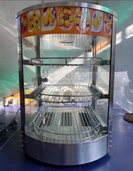 Food warmer Display Showcase (Category: Storage Boxes & Baskets) located in Manila. Submitted by makinaryageneral.merchandise (Listing ID 243694434, Image 1). Description: Stainless Steel Rack Food Warming Case Electric Buffet Food Warmer 1.Fashionable design with curved glass. 2.Easy thermostatically controlled,. 3.Water reservoir to provide humidity for food moisture. 4.Ideal for snack bars, convenience stores, bakeries, kiosks etc. Model Name: