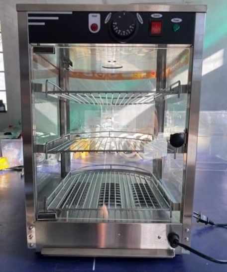Food warmer Display Showcase (Category: Storage Boxes & Baskets) located in Manila. Submitted by makinaryageneral.merchandise (Listing ID 243694434, Image 3). Description: Stainless Steel Rack Food Warming Case Electric Buffet Food Warmer 1.Fashionable design with curved glass. 2.Easy thermostatically controlled,. 3.Water reservoir to provide humidity for food moisture. 4.Ideal for snack bars, convenience stores, bakeries, kiosks etc. Model Name: