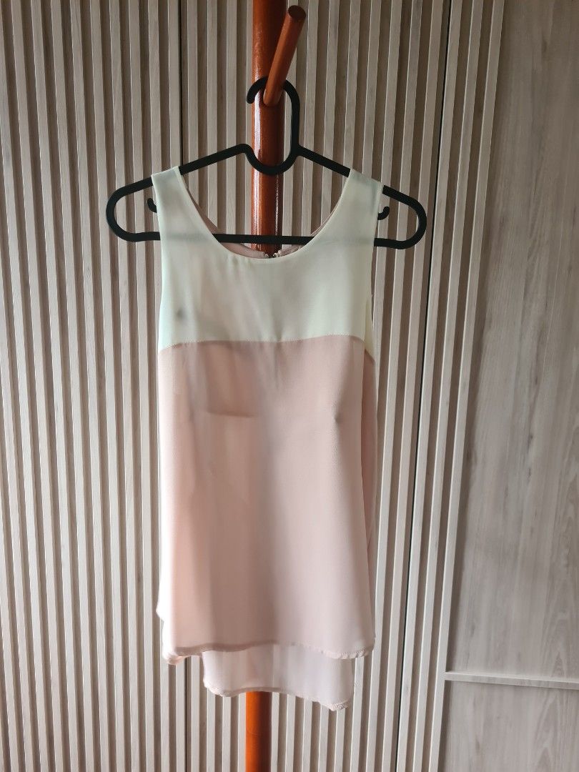 Korean basic top (Category: Sleeveless) located in Singapore. Submitted by rosmoss (Listing ID 1216673614, Image 1). Description: Nude sand / beige / cream basic top. Super fine chiffon (smooth fine kind not those cheapo ones) material in a slight racer cut. Sheer and will need nude undergarments fits uk 6- 10. 18" x 23" worn less than 5x. no visible defects..