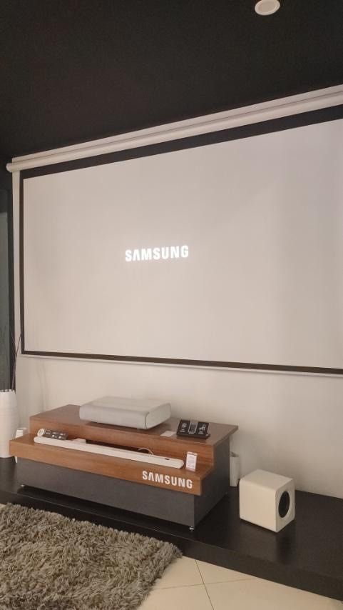 SAMSUNG THE PREMIERE SMART PROJECTOR SP-LSP9TGA (Category: Projectors) located in Quezon City. Submitted by maryann5721 (Listing ID 1216773521, Image 3). Description: SAMSUNG THE PREMIERE SP-LSP9TGA Samsung the premiere PICTURE UHD 4K Triple Laser Tehcnology 2,800 ANSI Lumen RESOLUTION 3,840 x 2,160 SCREEN SIZE 130″ SOUND Acoustic Beam Technology (4.2Ch 40W) DESIGN Ultra Short Throw (11cm) SMART Tap View Bixby Voice Assistant Filmmaker Mode Game 