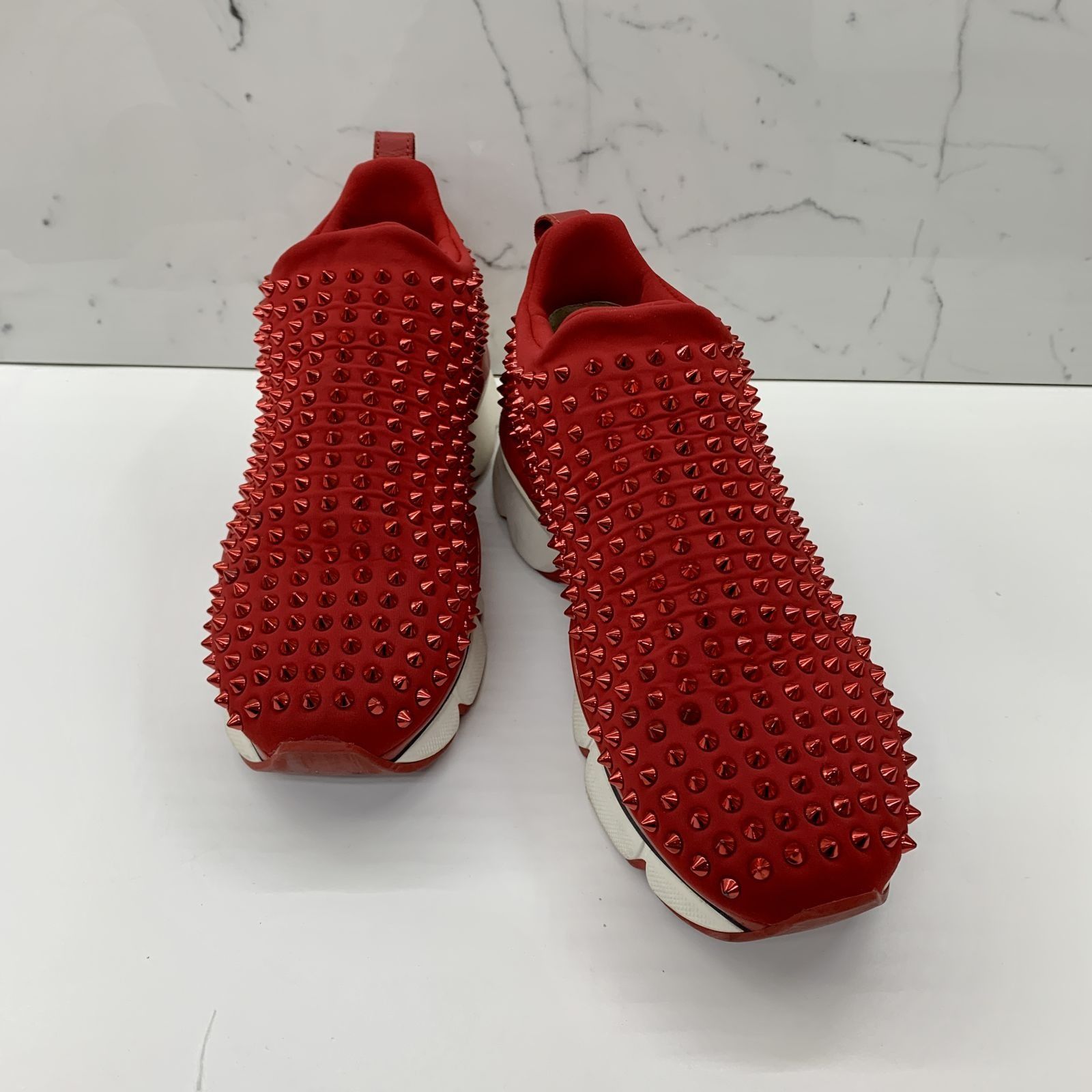 Red spiked sneakers discount