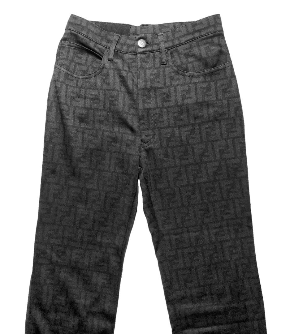 FENDI Vintage Monogram Zucca Jeans Pants (Category: Luxury Apparel) located in Manila. Submitted by abthree (Listing ID 1217189810, Image 1). Description: Features an all-over monogram print in black. High-waisted. Kind of stretchy material like elastane but not sure since the care tag is removed. Button and zipper closure. Silver metal hardwares and a gold YKK zipper closure. Brand tag is removed but has the label on the waistband at the back an