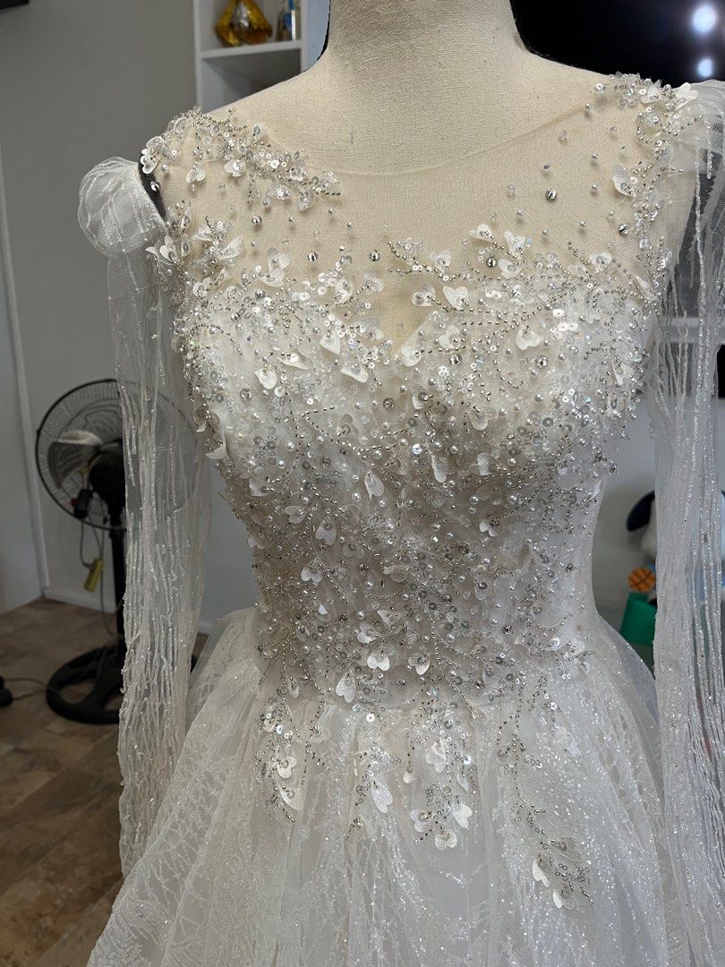 Glittery Wedding Gown (Category: Evening dresses & gowns) located in Rizal. Submitted by rinebee (Listing ID 1217071708, Image 2). Description: With washable stain at the front Needs sewing on the sleeves.