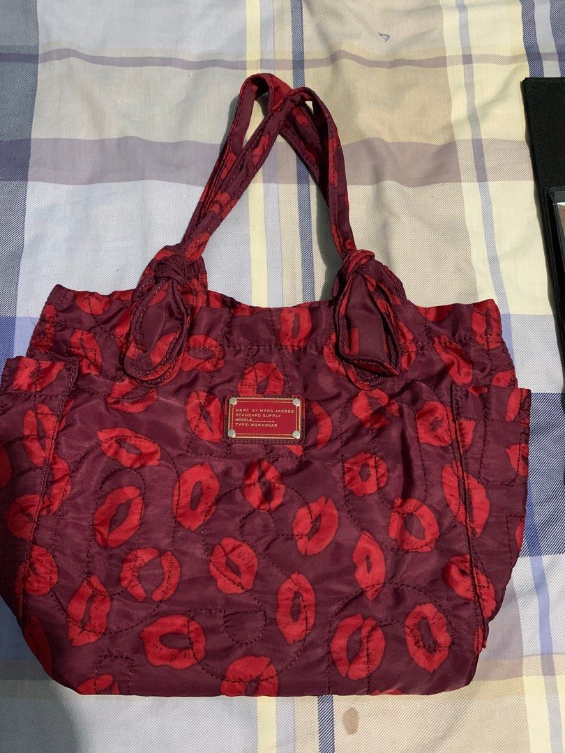 SALE! Marc Jacobs Nylon Bag (Category: Shoulder Bags) located in Quezon City. Submitted by meamelia (Listing ID 1217218362, Image 2). Description: Authentic Marc Jacobs Nylon Tote Size: Medium Reversible Color: red maroon pls refer to photos RFS: decluttering.