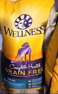 Still sealed, 24lb wellness, grain free, dog food bag, fish flavor.