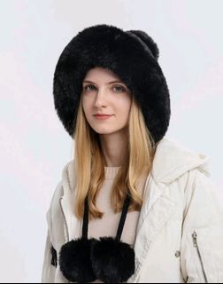 Fluffy winter hat with pompom design