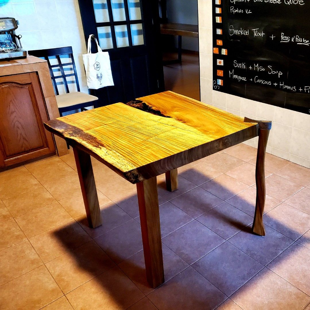 Hard to describe! Yes, this table has one foot made from an actual wood ...