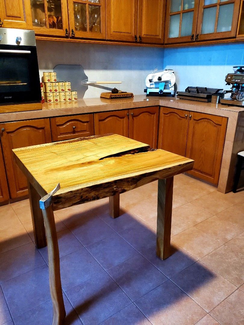 Hard to describe! Yes, this table has one foot made from an actual wood chopping axe., Furniture