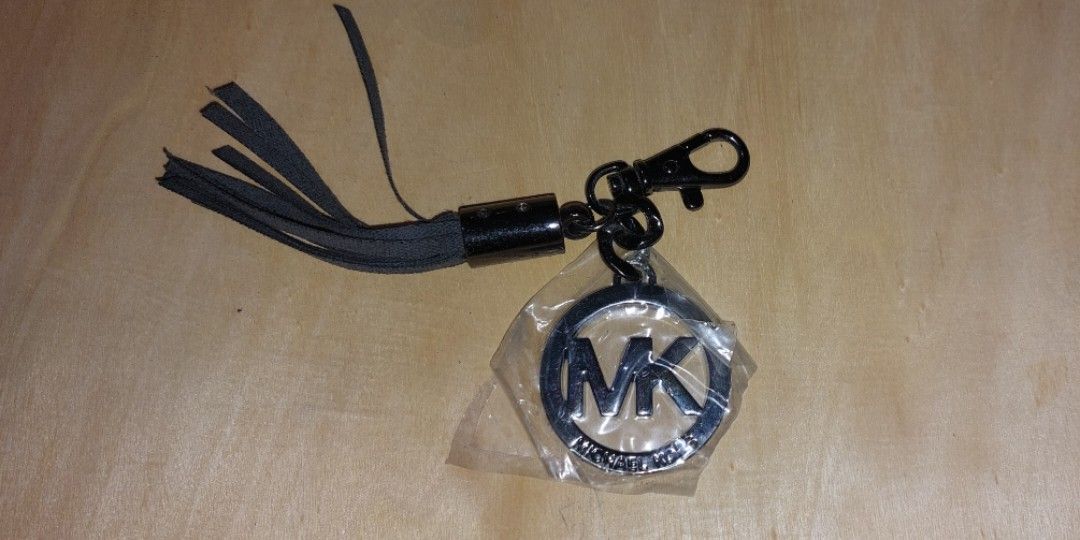 Michael kors hanging logo charm online