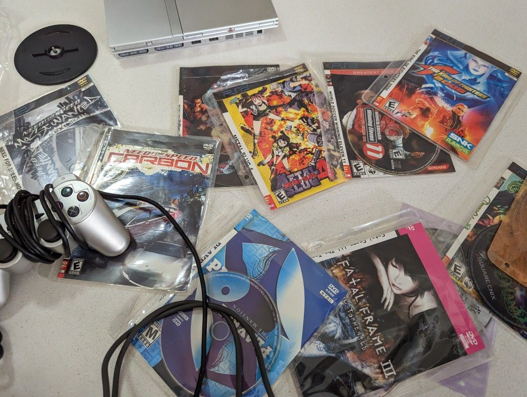 Ps2 slim console modded with 10+ games and few controller. Working ...
