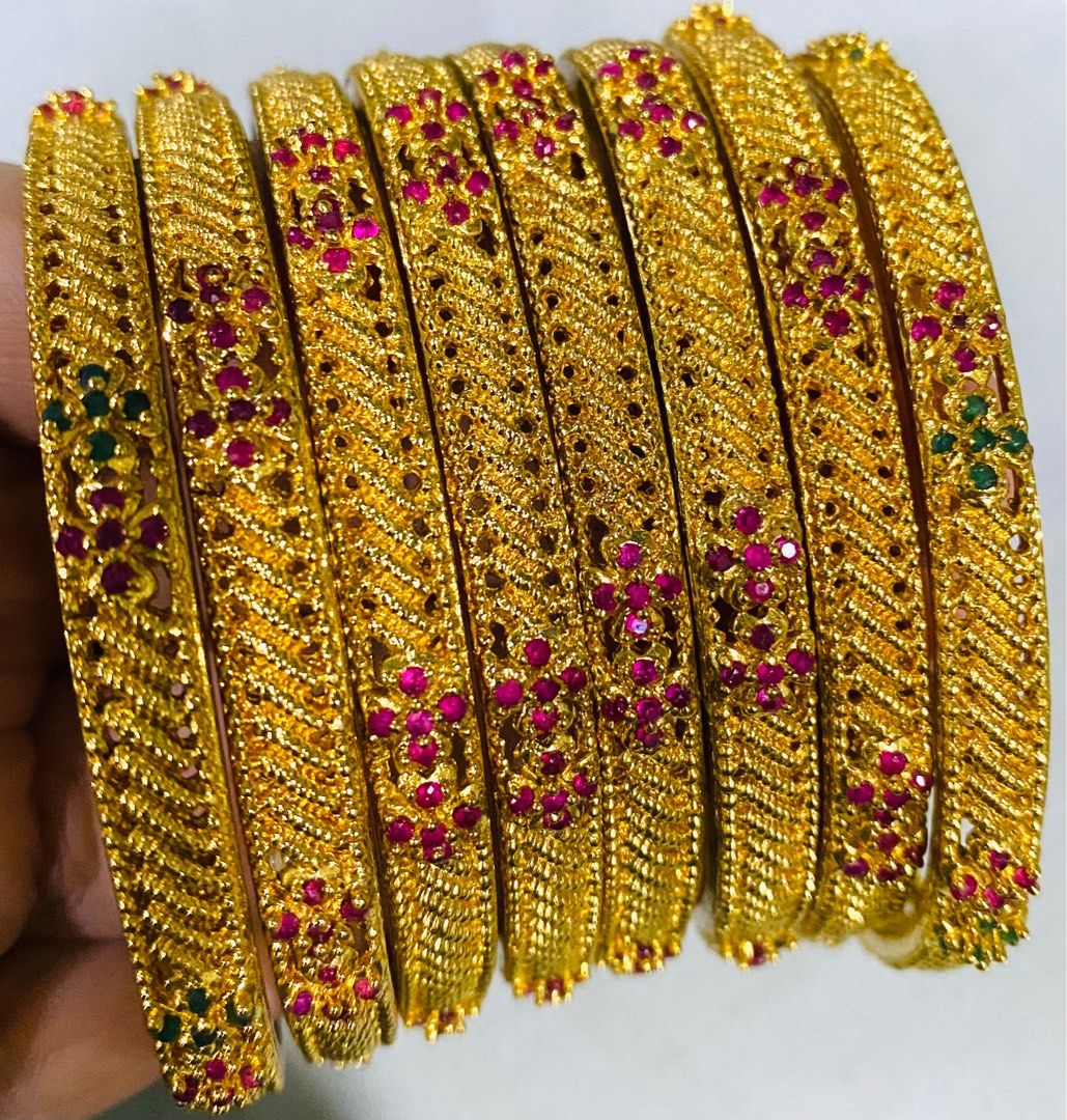 Gold bangles with green stones on sale