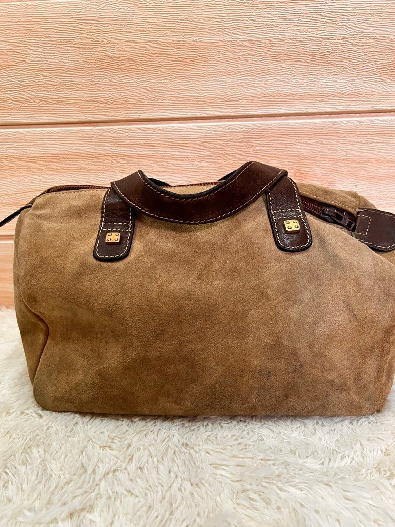 Authentic Loewe Mini Boston handbag (Category: Luxury Bags & Wallets) located in Cagayan de Oro. Submitted by riggstuffs (Listing ID 1217544461, Image 1). Description: Guaranteed authentic Loewe Mini Boston handbag Made in Spain Exterior material is made of suede and have some signs of use Interior is is clean and has no smell Disclaimer Riggstuffs is not associated or affiliated with the brand posted. All trademarks and copyrights belong solely 