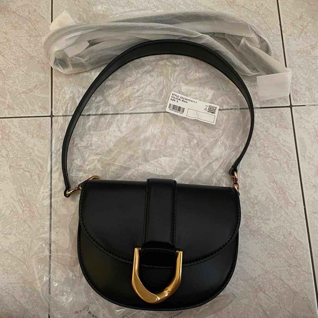 Charles & Keith Gabine Saddle Bag (M), Women's Fashion, Bags & Wallets,  Shoulder Bags on Carousell