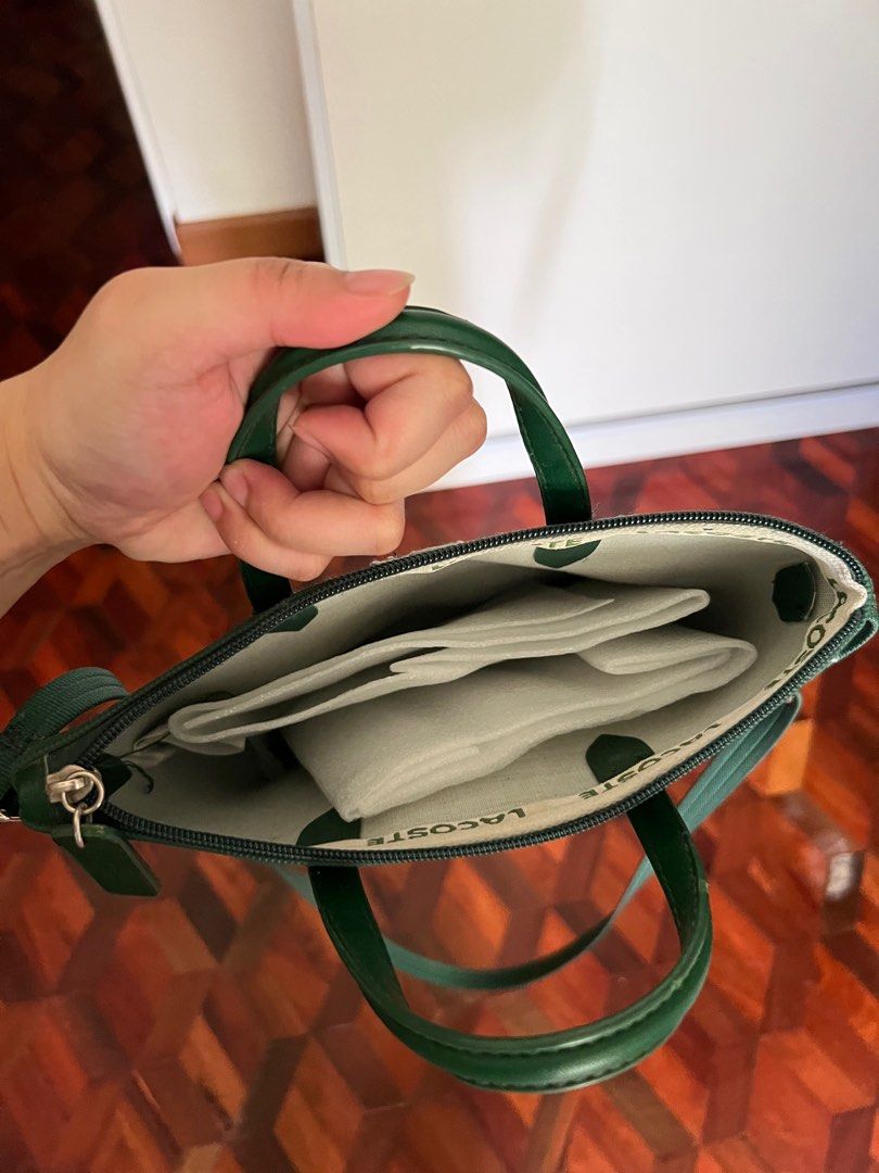 Lacoste Bag (preloved) (Category: Luxury Bags & Wallets) located in Cavite. Submitted by kcrtz (Listing ID 1217577175, Image 3). Description: Selling preloved bag (slingbag) Rfs: decluttering.