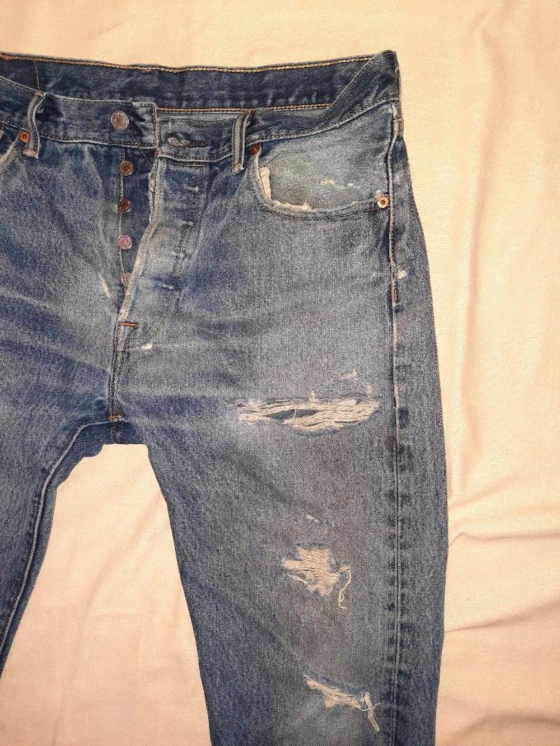 Levi's 501 ripped jeans on Carousell