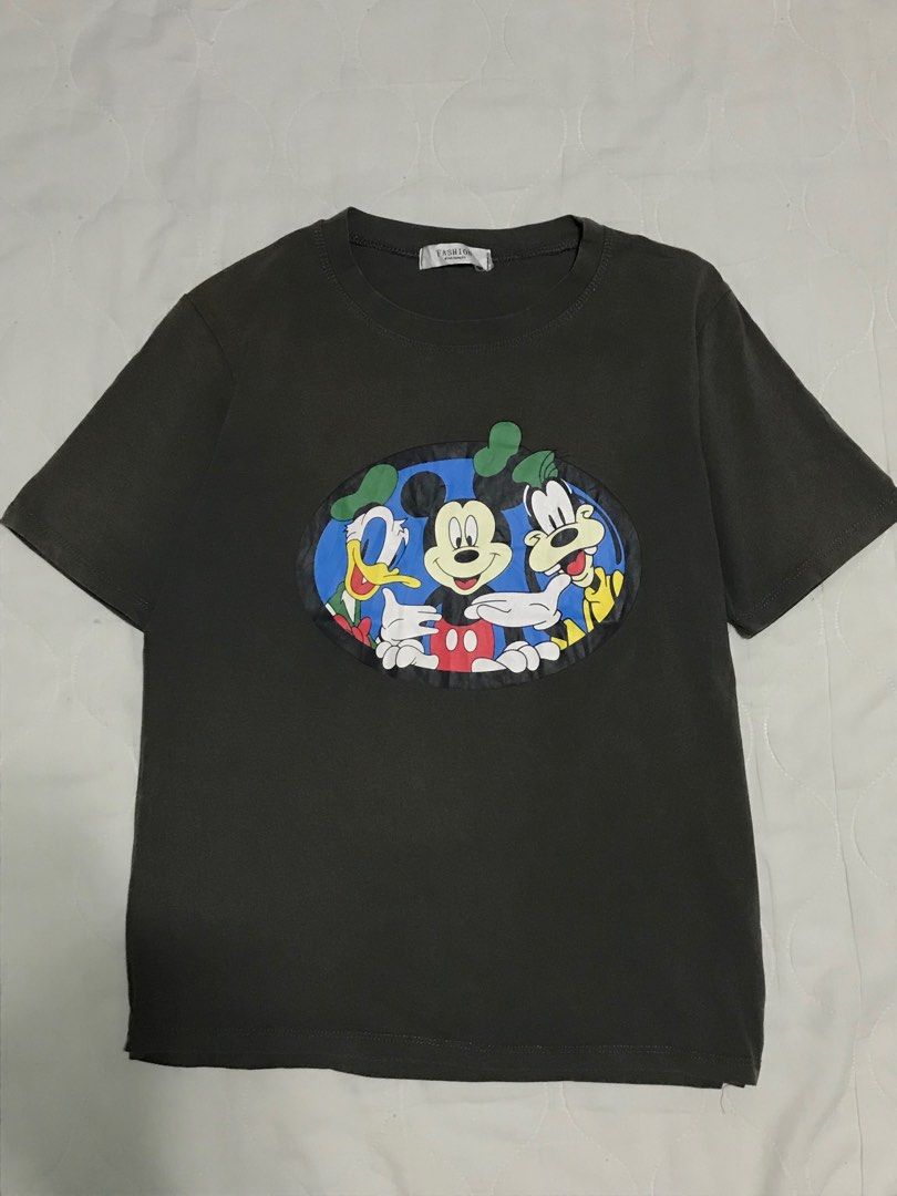 Mickey Mouse Tshirt (Category: Shirts) located in Binan City. Submitted by lagunaxpreloved (Listing ID 1217608221, Image 1). Description: PRELOVED NEED WASH 9/10 Condition Size L-XL DIMENSION LENGTH 24 WIDTH 19 150 ADD SF.