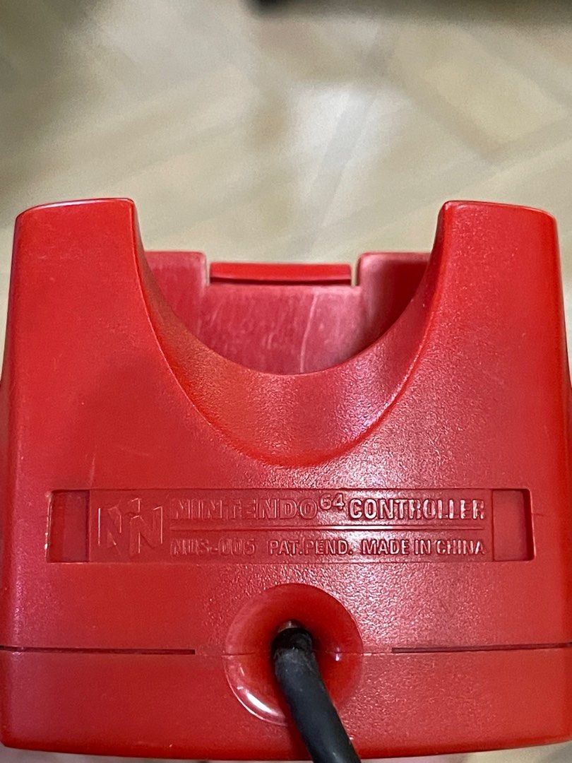 Nintendo 64 NUS-005 Red Controller Untested (Category: Controllers) located in Taguig. Submitted by johnhb (Listing ID 1217492801, Image 3). Description: Selling as untested. No warranties or refunds. MOP: Gcash MOD: Lalamove from BGC (No COD!).