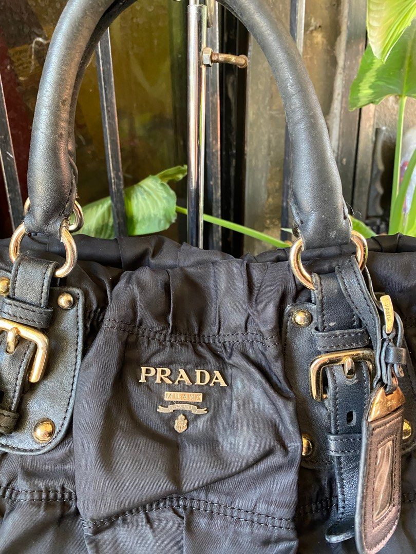 ORIG PRADA TESSUTO BAG😍 (Category: Luxury Bags & Wallets) located in Bacolod City. Submitted by chuchaystuffs (Listing ID 1217452128, Image 3). Description: Signs of use sa handle Meron gas gas Tpos wla na po sling at code nya see pics to appreciate .