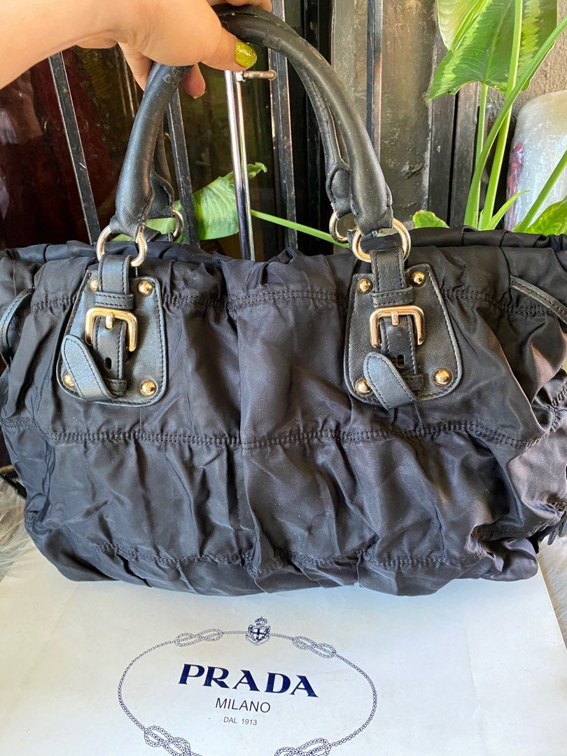 ORIG PRADA TESSUTO BAG😍 (Category: Luxury Bags & Wallets) located in Bacolod City. Submitted by chuchaystuffs (Listing ID 1217452128, Image 2). Description: Signs of use sa handle Meron gas gas Tpos wla na po sling at code nya see pics to appreciate .