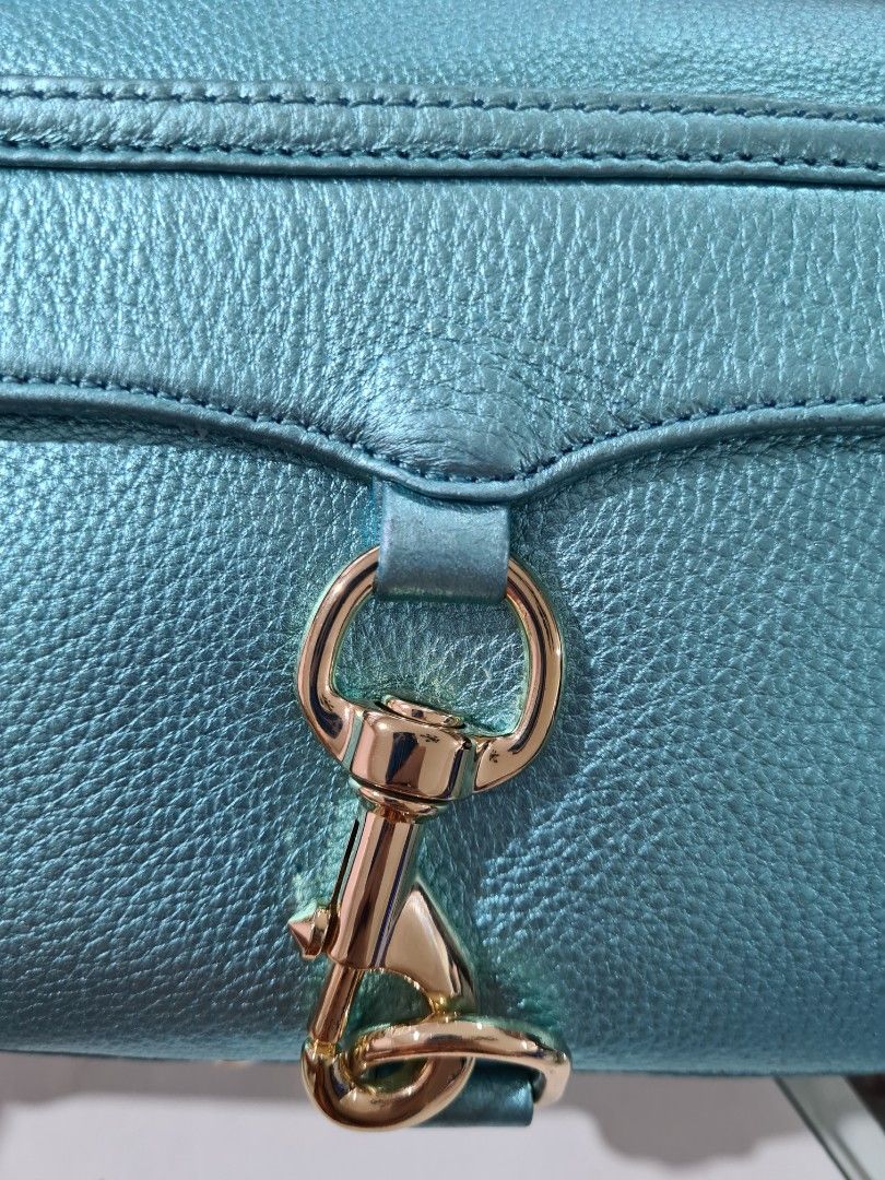 Authentic Rebecca Minkoff Mini Mac in Metallic Turquoise (Category: Luxury Bags & Wallets) located in Paranaque City. Submitted by thepennydreadful (Listing ID 1217572841, Image 2). Description: only used less than 5 times but has been in storage for a while and is also the cause of some of the flaws on the leather (please view pictures) doesn't affect the overall structure of the bag. still a great bag and a beautiful color. complete inclusions 