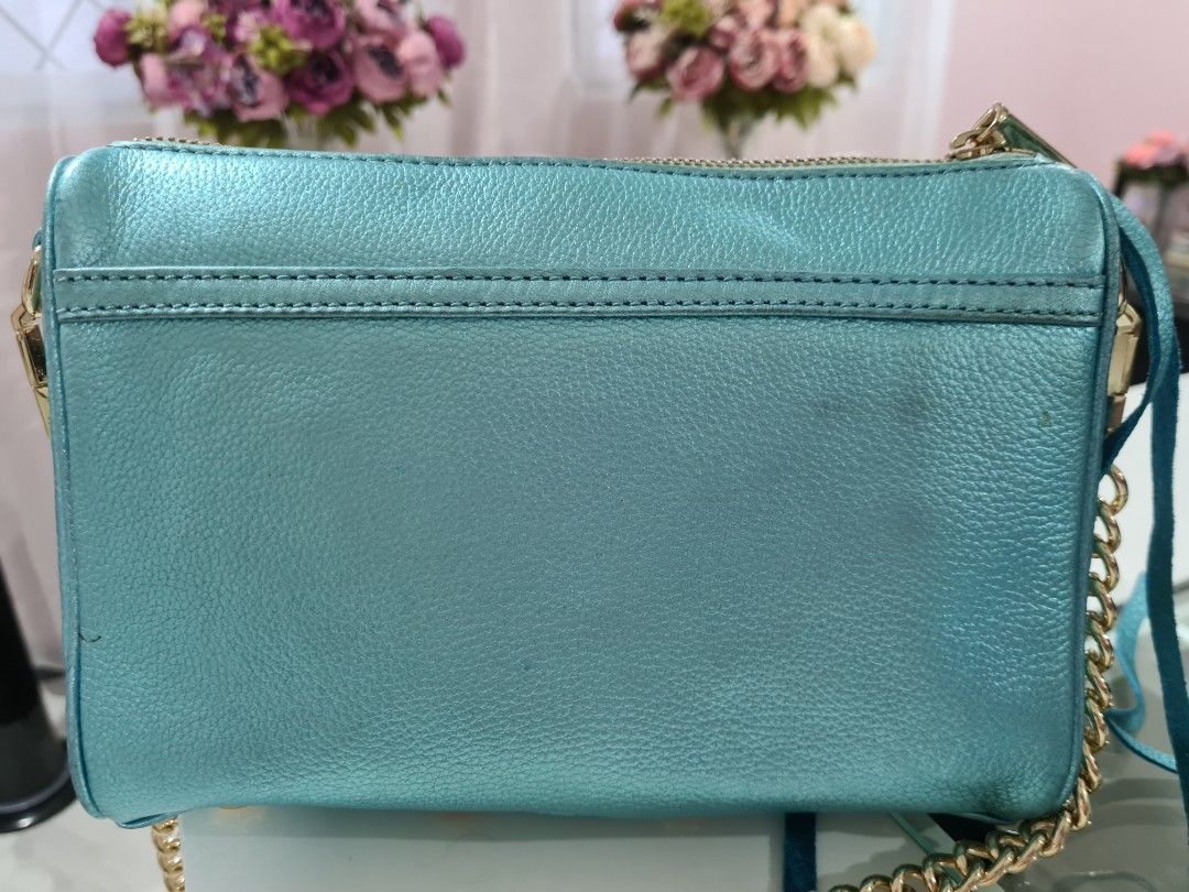 Authentic Rebecca Minkoff Mini Mac in Metallic Turquoise (Category: Luxury Bags & Wallets) located in Paranaque City. Submitted by thepennydreadful (Listing ID 1217572841, Image 3). Description: only used less than 5 times but has been in storage for a while and is also the cause of some of the flaws on the leather (please view pictures) doesn't affect the overall structure of the bag. still a great bag and a beautiful color. complete inclusions 