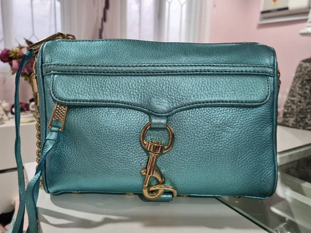 Authentic Rebecca Minkoff Mini Mac in Metallic Turquoise (Category: Luxury Bags & Wallets) located in Paranaque City. Submitted by thepennydreadful (Listing ID 1217572841, Image 1). Description: only used less than 5 times but has been in storage for a while and is also the cause of some of the flaws on the leather (please view pictures) doesn't affect the overall structure of the bag. still a great bag and a beautiful color. complete inclusions 