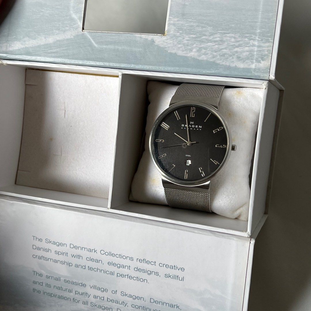 Skagen Dress Watch (Category: Men's Watches) located in Taguig. Submitted by ginoerms (Listing ID 1217461542, Image 3). Description: Skagen Dress Watch with Date 40mm diameter Black Dial Steel Bracelet Needs battery (no battery in watch) Comes w box only.