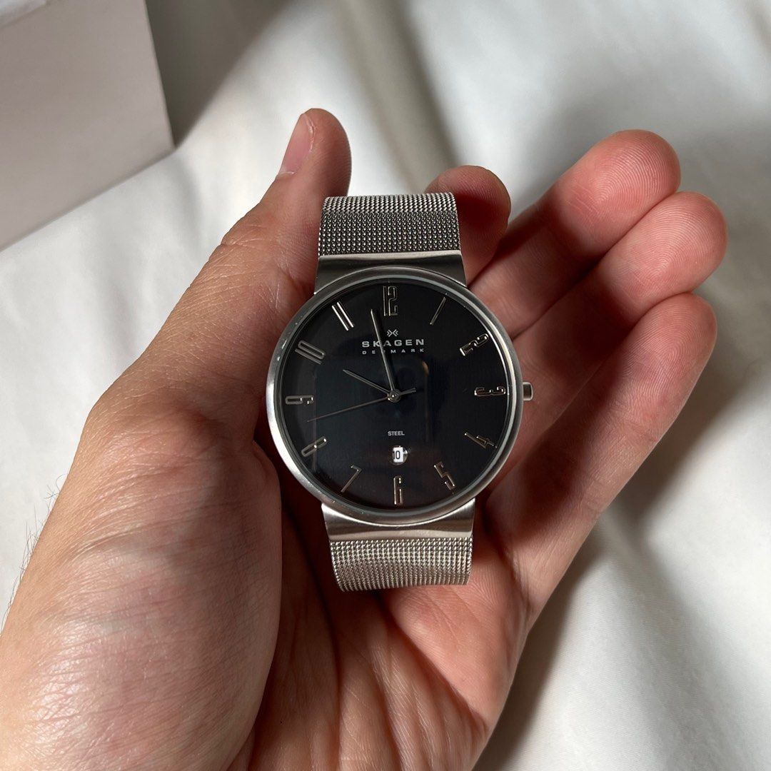 Skagen Dress Watch (Category: Men's Watches) located in Taguig. Submitted by ginoerms (Listing ID 1217461542, Image 1). Description: Skagen Dress Watch with Date 40mm diameter Black Dial Steel Bracelet Needs battery (no battery in watch) Comes w box only.