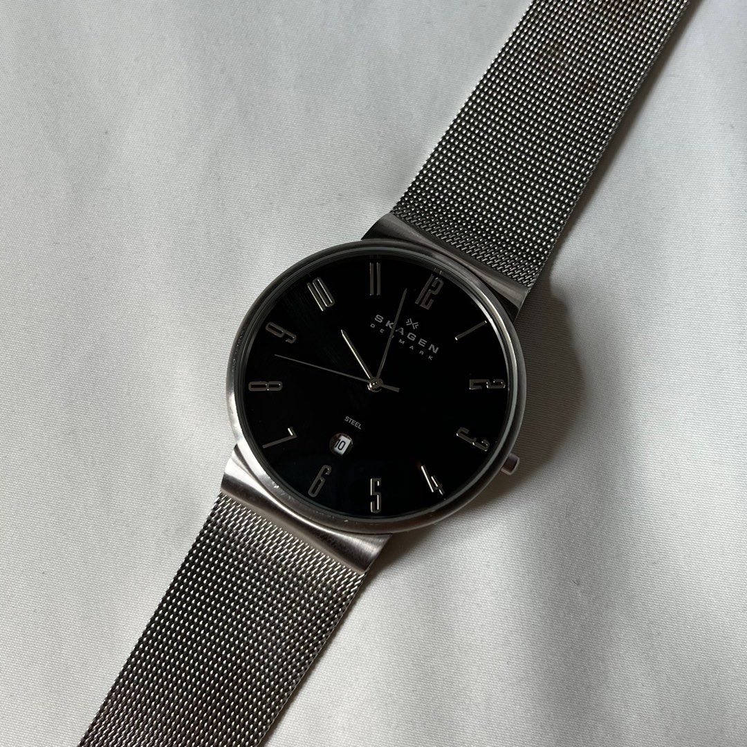 Skagen Dress Watch (Category: Men's Watches) located in Taguig. Submitted by ginoerms (Listing ID 1217461542, Image 2). Description: Skagen Dress Watch with Date 40mm diameter Black Dial Steel Bracelet Needs battery (no battery in watch) Comes w box only.