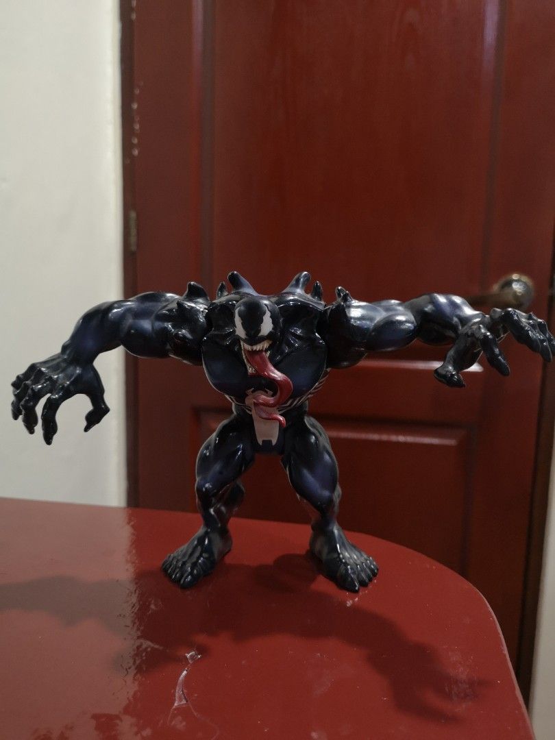 Ultimate Spiderman Venom Toy (Category: Action & Battle Toys) located in Quezon City. Submitted by jotioco (Listing ID 1217571522, Image 2). Description: No box included. Venom figure includes pull able back logo to move arms automatically. In good condition.