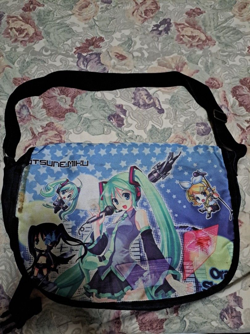 Pre-loved Hatsune Miku messenger bag (Category: Cross-body Bags) located in Makati City. Submitted by angelmetatron (Listing ID 216383776, Image 2). Description: Bought this from a local anime convention and it has been with me for about 3 years. The bag has two compartments with the main compartment could fit a 13" laptop. There's a slight damage on the image print but nothing a quick stitching could fix. Payment Options: - GCash - Paymaya - BPI
