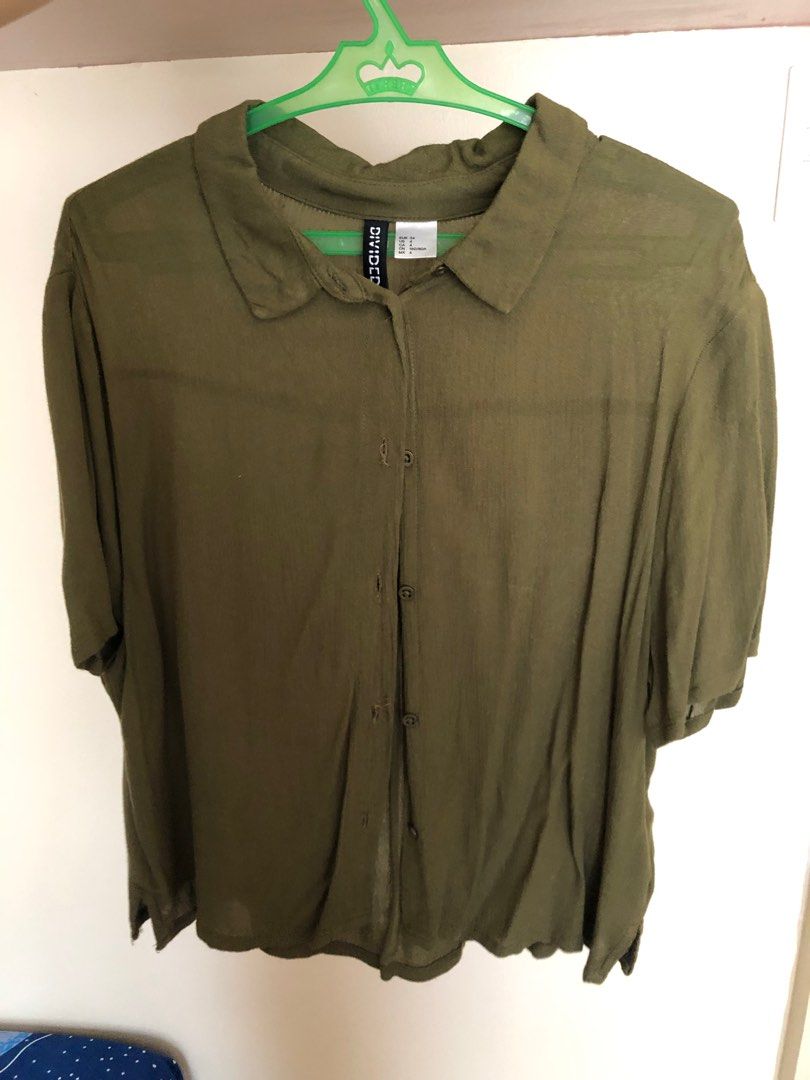H&M Olive Green Short Sleeves Top (Category: Blouses) located in Makati City. Submitted by histripes (Listing ID 1217846455, Image 1). Description: Used to be my favorite!!! Outgrew it lang 🥲 Fabric is super lightweight and breathable! A little cropped. EUR 34 on tag. 📱[MOP] Gcash, BPI, BDO, Metrobank! 📦 [MOD] SF shouldered by buyer, can ship anywhere! Msg me for any questions! Can provide actual dimensions and more photos upon request. .