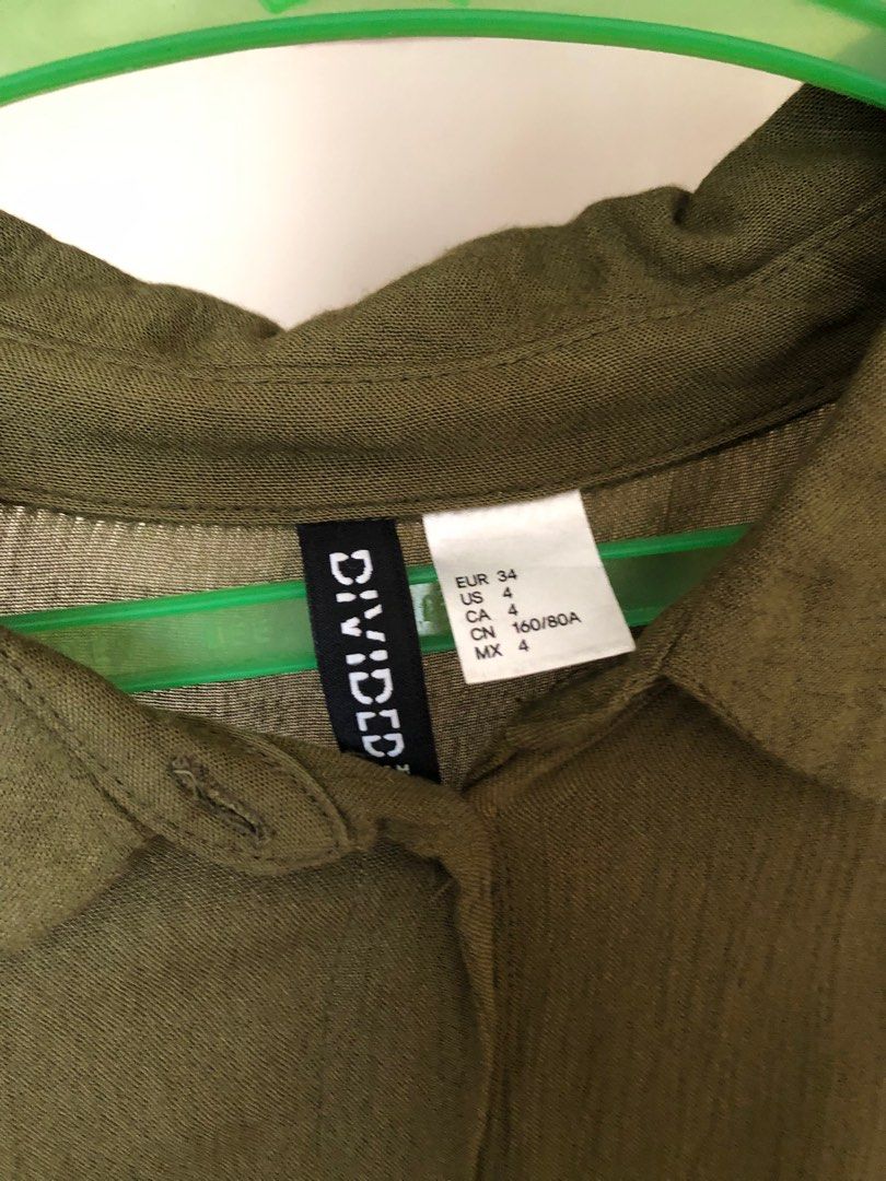 H&M Olive Green Short Sleeves Top (Category: Blouses) located in Makati City. Submitted by histripes (Listing ID 1217846455, Image 3). Description: Used to be my favorite!!! Outgrew it lang 🥲 Fabric is super lightweight and breathable! A little cropped. EUR 34 on tag. 📱[MOP] Gcash, BPI, BDO, Metrobank! 📦 [MOD] SF shouldered by buyer, can ship anywhere! Msg me for any questions! Can provide actual dimensions and more photos upon request. .