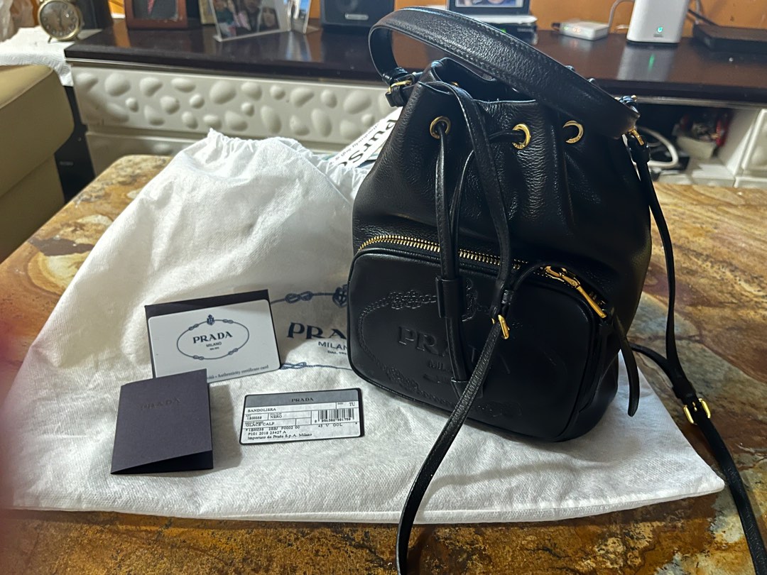 Leather bucket bag prada top