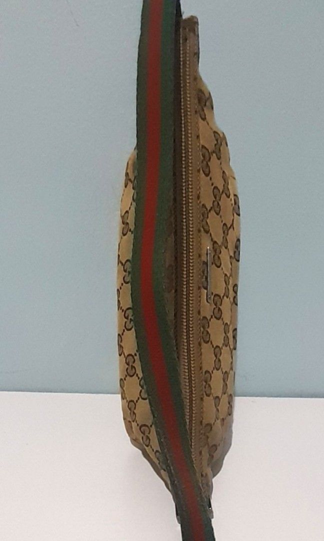 AUTHENTIC GUCCI MONOGRAM SHOULDER BAG ( KILIKILI BAG ) (Category: Luxury Bags & Wallets) located in Quezon City. Submitted by juctionstreetwear (Listing ID 1213175113, Image 3). Description: GOOD CONDITION NEEDS CLEANING ON THE OUTSIDE CANVASS. RUBS ON THE CORNER SIZE : Length: 10 inches Width: 3 inches Height :4 inches.