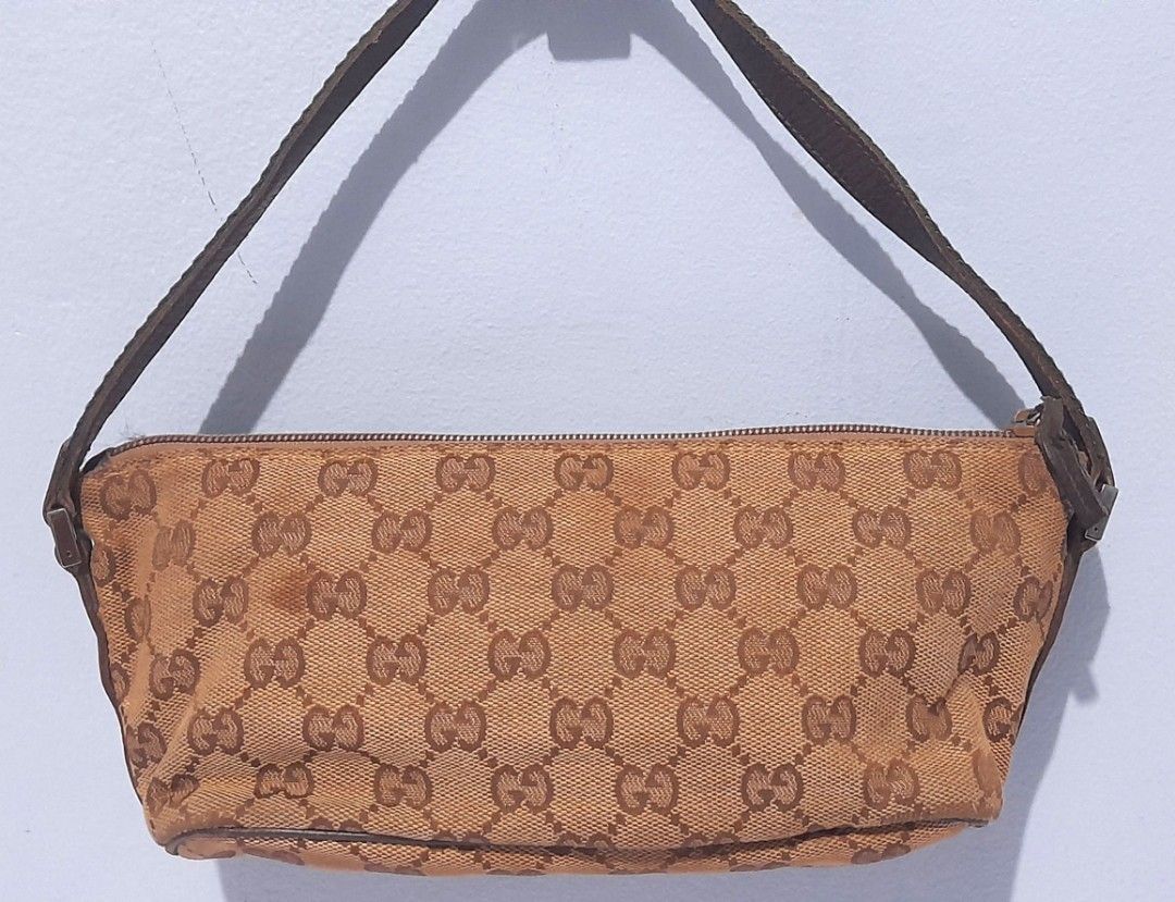 AUTHENTIC GUCCI MONOGRAM SHOULDER BAG ( KILIKILI BAG ) (Category: Luxury Bags & Wallets) located in Quezon City. Submitted by juctionstreetwear (Listing ID 1213175113, Image 1). Description: GOOD CONDITION NEEDS CLEANING ON THE OUTSIDE CANVASS. RUBS ON THE CORNER SIZE : Length: 10 inches Width: 3 inches Height :4 inches.