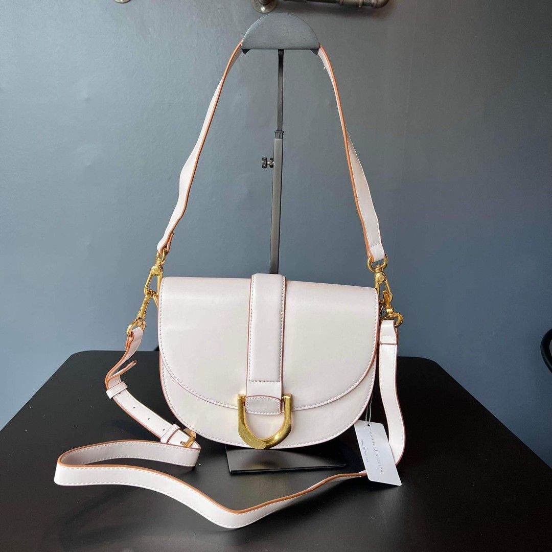 Charles & Keith Gabine Saddle Bag (M), Women's Fashion, Bags & Wallets,  Shoulder Bags on Carousell