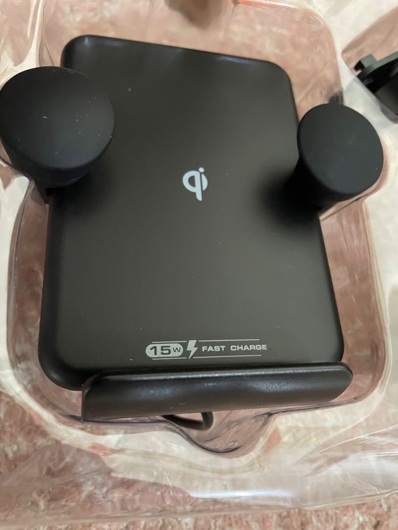 Fast Charging Wireless Car Charger 15W for iOS or Android (Category: Chargers & Cables) located in Manila. Submitted by thecluttershop_2018 (Listing ID 1213215674, Image 2). Description: New and unused, just tested with my iPhone 13 and works perfectly well. Rfs: decluttering. With box and manual, box is a bit dusty and worn out due to poor storage.