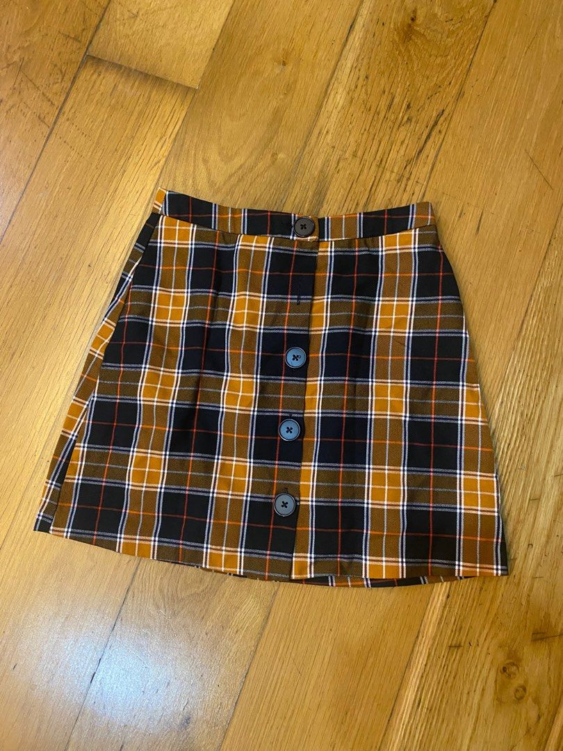 Stradivarius skirt (Category: Skirts) located in Manila. Submitted by kellypickle (Listing ID 1213304011, Image 1). Description: Stradivarius plaid skirt. Issue: 1 button is missing but i used ti pin it when i use it..