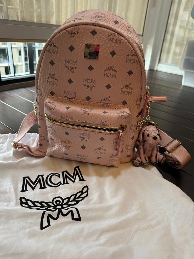 Authentic Brand New MCM Backpack with Dog plush, Women's Fashion, Bags &  Wallets, Backpacks on Carousell