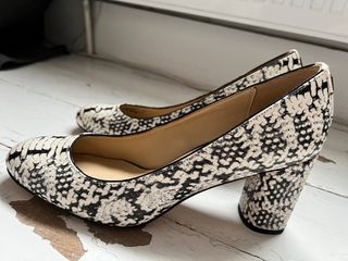 Brand new Coach heels in black/white snakeskin.US 9.5