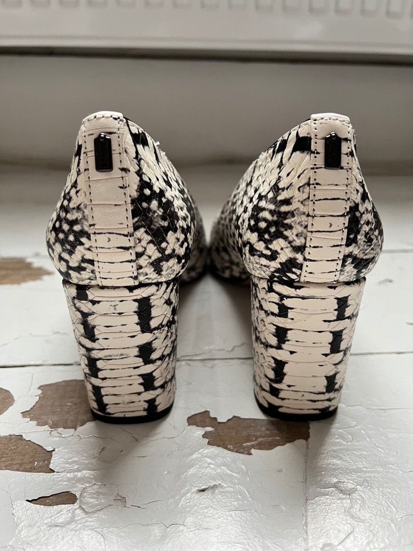 Black and white snakeskin heels top