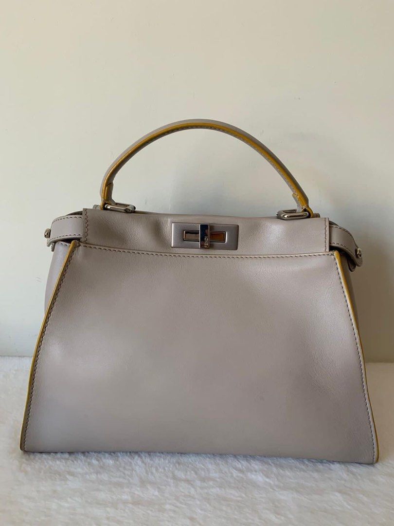 Fendi Peekaboo Medium Bag (Category: Luxury Bags & Wallets) located in Manila. Submitted by bagislifeshop (Listing ID 1213422772, Image 2). Description: ▪️Fendi Peekaboo Medium Bag▪️ ☑️Available in Pampanga ✅Condition: 8.5/10 ✅Material: Calf leather in PHW ✅Colour: Light gray and yellow ✅Inclusions: dustbag, raincoat and long strap .